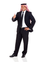 Obraz na płótnie Canvas arab man in black suit giving thumb up
