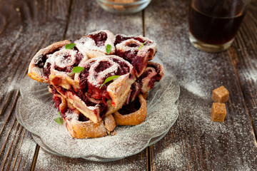 small cherry buns with powdered sugar