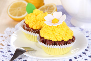 Beautiful lemon cupcakes on dining table close-up