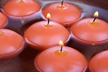 Beautiful candles in water close-up