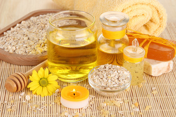 Obraz na płótnie Canvas Fragrant honey spa with oils and honey on wooden table close-up
