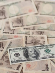 100 US dollar note isolated on Japanese yen note background