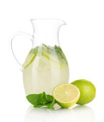 Lemonade in pitcher isolated on white