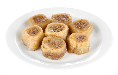 Sweet baklava on plate isolated on white