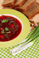 Delicious borsch on table close-up