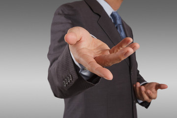 Fototapeta premium business man with an open hand as showing something