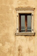 vintage wooden window on old wall
