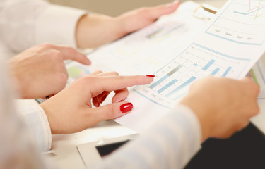 Business colleagues sitting together at table