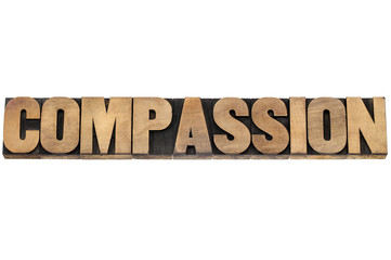 compassion word in wood type
