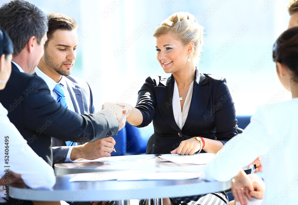 Wall mural happy business man and woman shaking hands