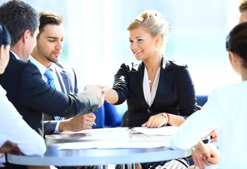 Happy business man and woman shaking hands