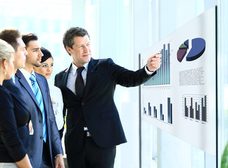 Business people having on presentation at office.