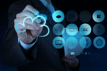 Businessman working with a Cloud Computing diagram on the new co