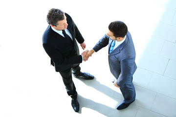 Top view of a two businessman shaking hands