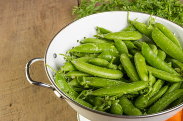 Fresh green peas in bowl