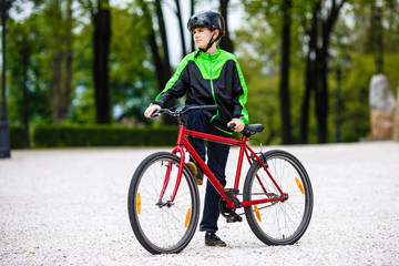 Fototapeta premium Urban biking - teenage boy and bike in city