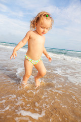child walking beach