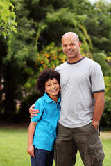Happy and relaxed mixed race father and son
