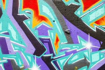 Naklejka premium Colorful graffiti, abstract grunge grafiti background over textu