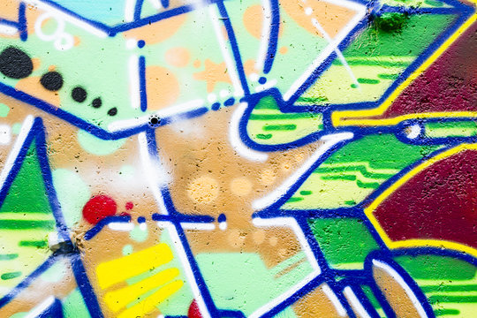 Colorful graffiti, abstract grunge grafiti background over textu