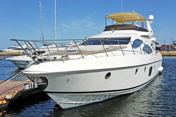 Fototapeta premium White motor yacht over harbor pier, Odessa, Ukraine