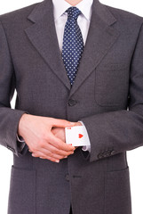 Businessman with ace card hidden under sleeve.