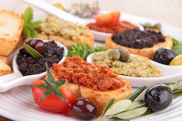 assortment of tapenade and toast