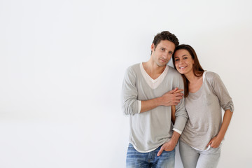 Couple standing on white background
