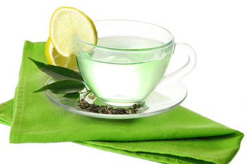 Transparent cup of green tea with lemon