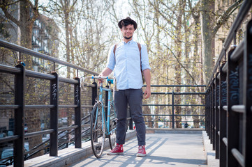 hipster young man on bike