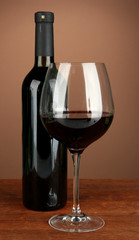 Composition of wine bottle and  glass of red wine,