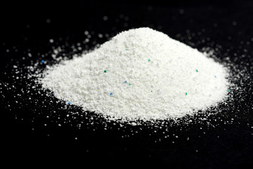 washing powder on black background