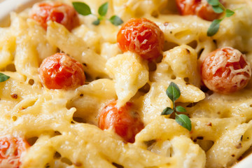 penne pasta baked with cheese in the oven