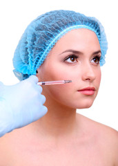 Young woman receiving plastic surgery injection