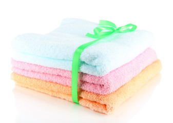 Obraz na płótnie Canvas Towels tied with ribbon isolated on white