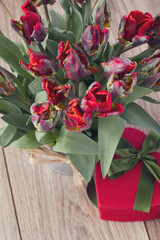 bouquet of  red tulips on wooden table