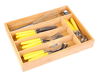 Wooden cutlery box with checked cutlery isolated on white