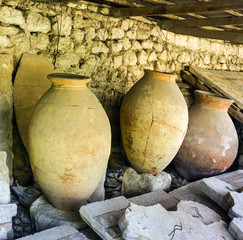 Ancient clay pots and mosaic excavations into Greek town ruins