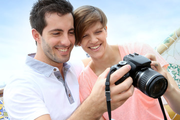 Tourists in Guell park looking at camera shots