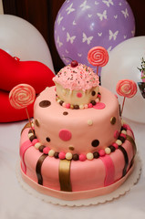 Wonderful birthday cake over balloons background