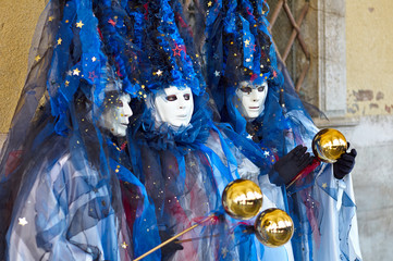 Venetian costume attends Carnival of Venice.