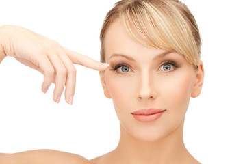 beautiful woman touching her eye area