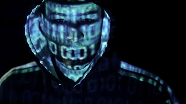 Camera spinning around a Hacker with binary codes projections