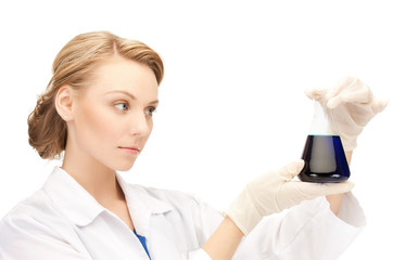 female chemist holding bulb with chemicals