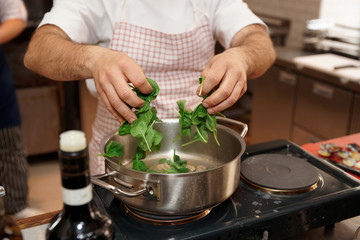 Chef is putting corn salad in casserole