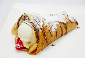 Pancakes with ice-cream, strawberries and bananas