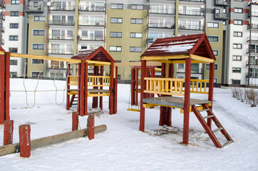 playground wooden red houses swing rope winter