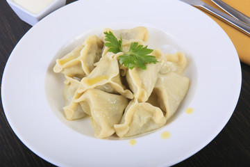 pelmeni in white plate