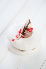 Vertical shot of a fancy cake on wooden boards