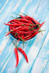 Still life food: red chili peppers on wooden boards